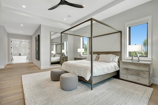 bedroom featuring ceiling fan and light hardwood / wood-style flooring