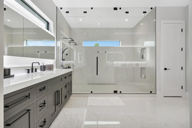 bathroom with tile patterned floors, vanity, and a shower with shower door