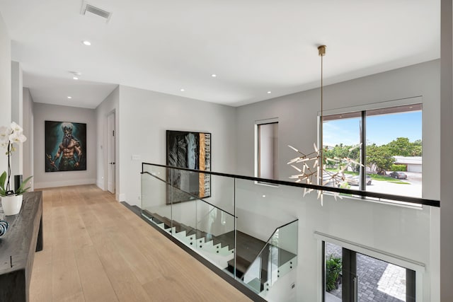 corridor featuring light hardwood / wood-style floors