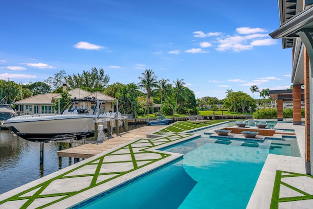 view of swimming pool featuring an in ground hot tub, a boat dock, a patio, and a water view