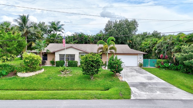 ranch-style house with a garage and a front lawn