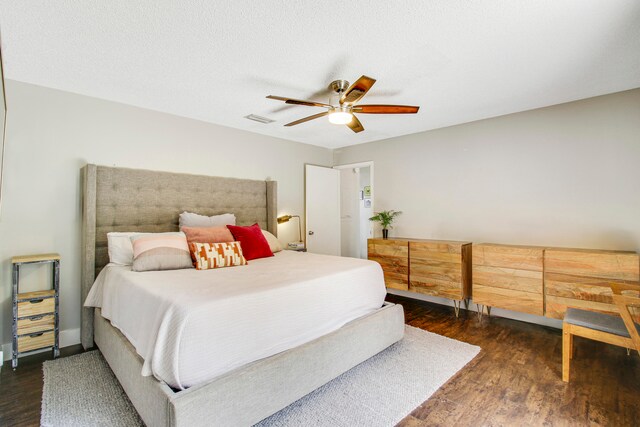 bedroom featuring ceiling fan and dark wood-type flooring