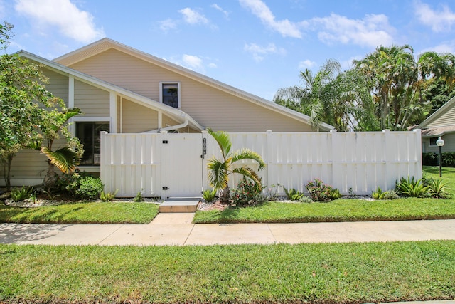 view of front of home with a front lawn