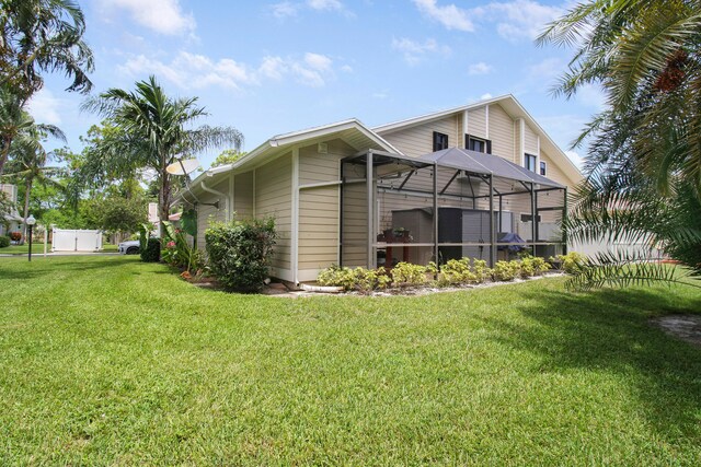 view of side of property featuring a yard