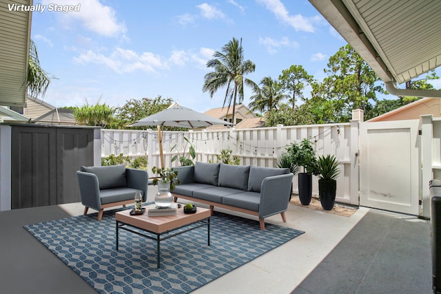 view of patio featuring fence and outdoor lounge area