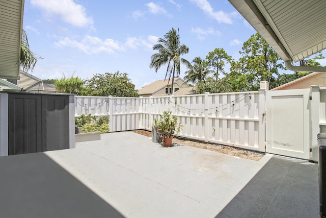 view of patio / terrace with a gate and fence