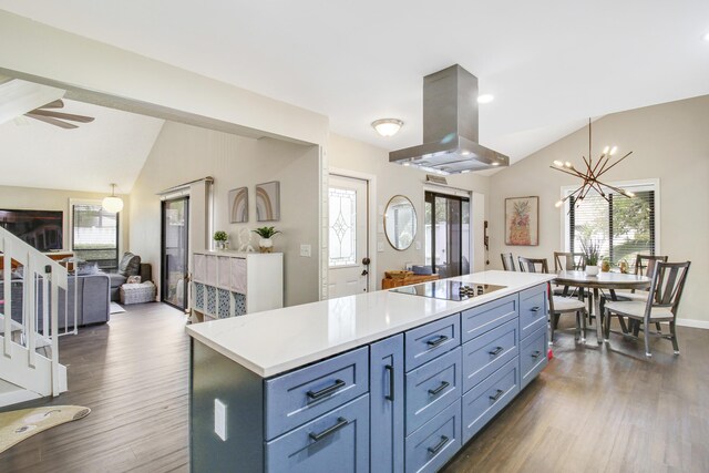 kitchen featuring island range hood, lofted ceiling, dark wood-type flooring, and black electric cooktop