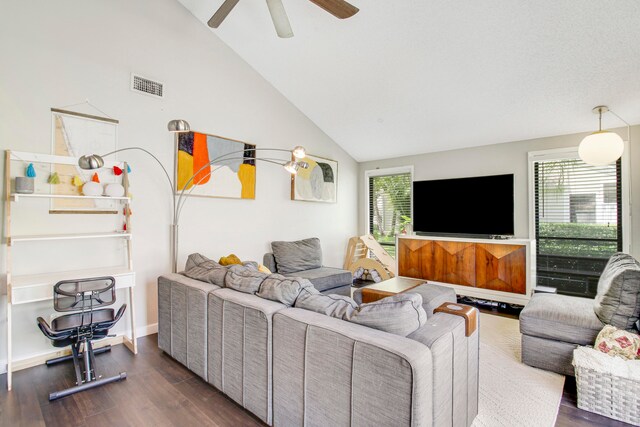 living room featuring dark hardwood / wood-style flooring, high vaulted ceiling, a wealth of natural light, and ceiling fan