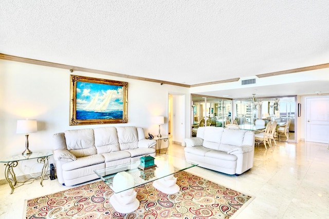 living room featuring a textured ceiling and crown molding