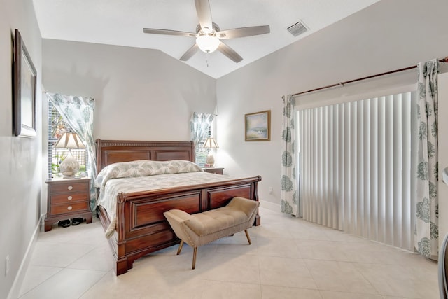 bedroom with lofted ceiling, ceiling fan, and light tile patterned floors