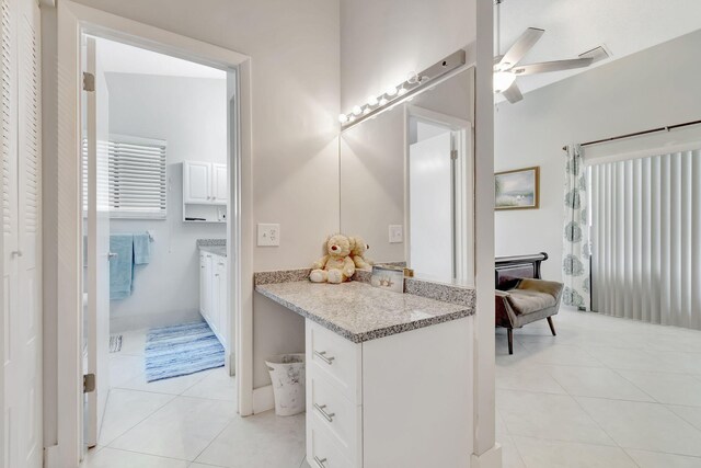 bathroom featuring vanity, ceiling fan, and tile patterned floors