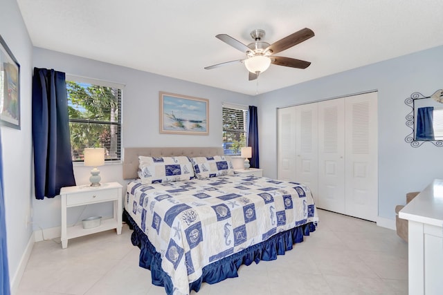 tiled bedroom featuring ceiling fan, a closet, and multiple windows