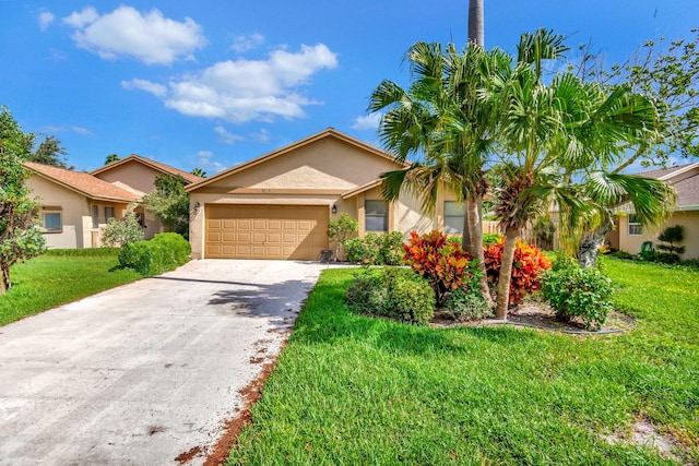 view of front facade featuring a front lawn, concrete driveway, and stucco siding