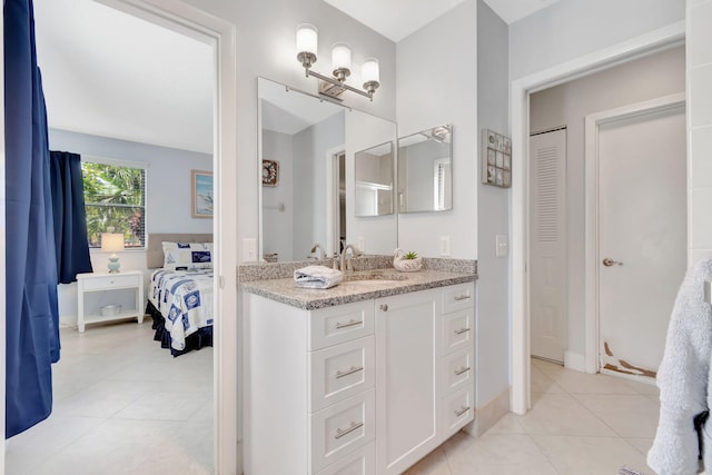 bathroom with tile patterned flooring and vanity