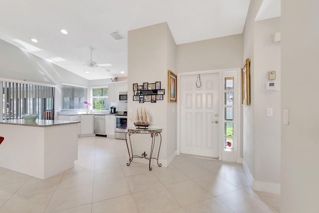 entryway featuring recessed lighting, visible vents, baseboards, vaulted ceiling, and a ceiling fan