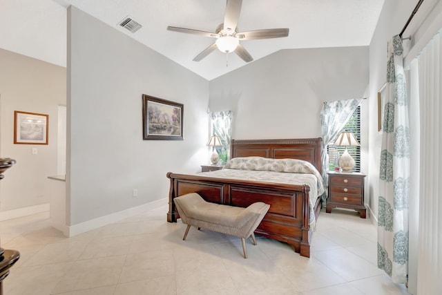 bedroom with vaulted ceiling, light tile patterned floors, and ceiling fan