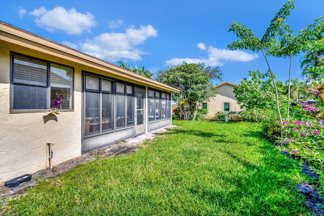 view of yard featuring a sunroom