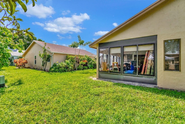 view of yard with a sunroom