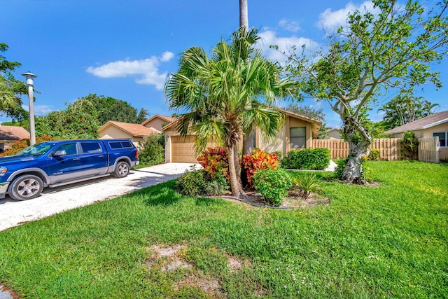 single story home with a garage and a front yard