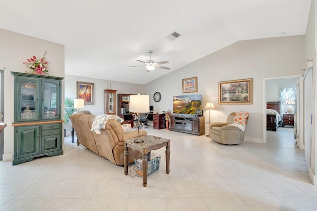 living room with vaulted ceiling, light tile patterned flooring, and ceiling fan