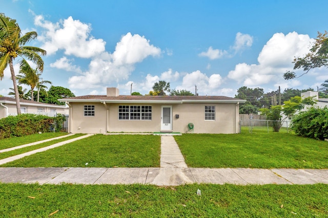 view of front of home with a front yard