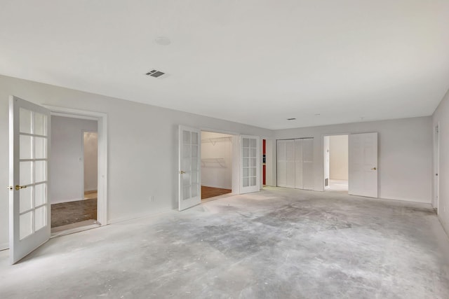 empty room featuring french doors