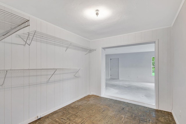 spacious closet with parquet flooring