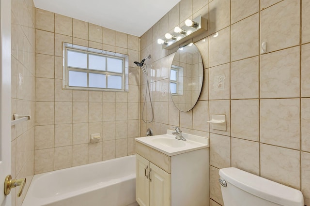 full bathroom with tile walls, tiled shower / bath, and toilet