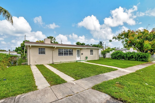 view of front of property with a front lawn