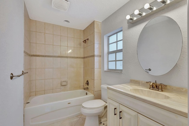 full bathroom featuring a textured ceiling, tiled shower / bath combo, tile patterned floors, vanity, and toilet