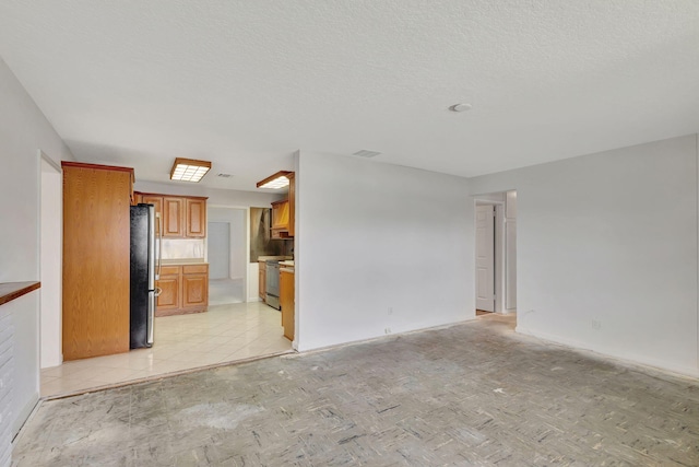 unfurnished living room with a textured ceiling