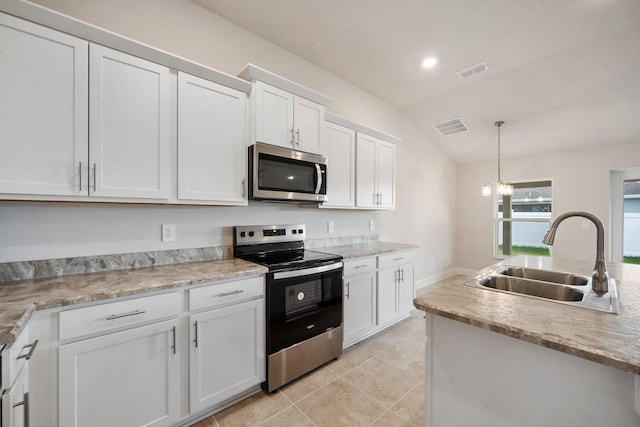 kitchen featuring sink, white cabinetry, stainless steel appliances, and vaulted ceiling