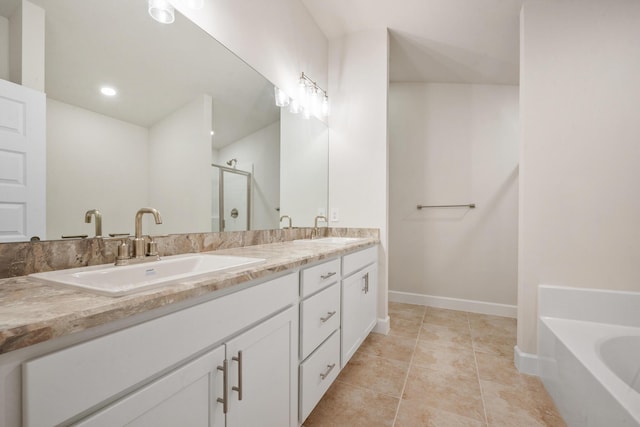 bathroom with tile patterned flooring, vanity, and plus walk in shower