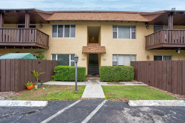 multi unit property featuring a balcony