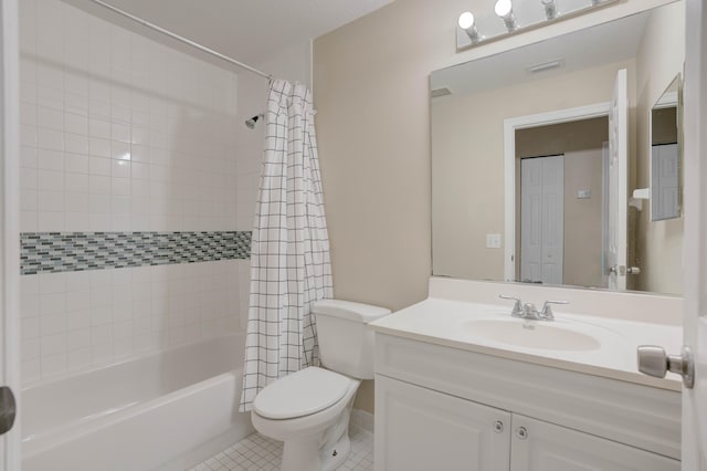 full bathroom with tile patterned floors, vanity, shower / tub combo, and toilet