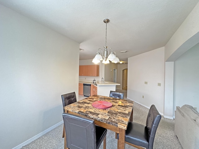 dining area featuring light colored carpet, baseboards, a notable chandelier, and arched walkways