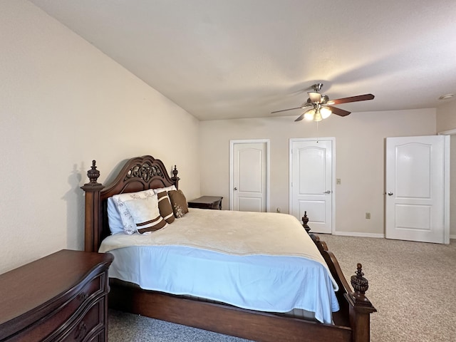 carpeted bedroom featuring baseboards and ceiling fan