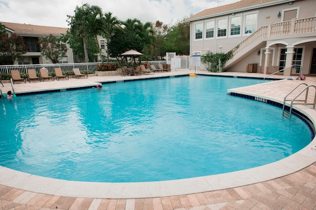 view of swimming pool featuring a patio