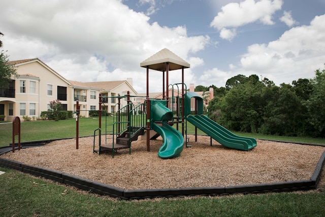 community jungle gym with a yard