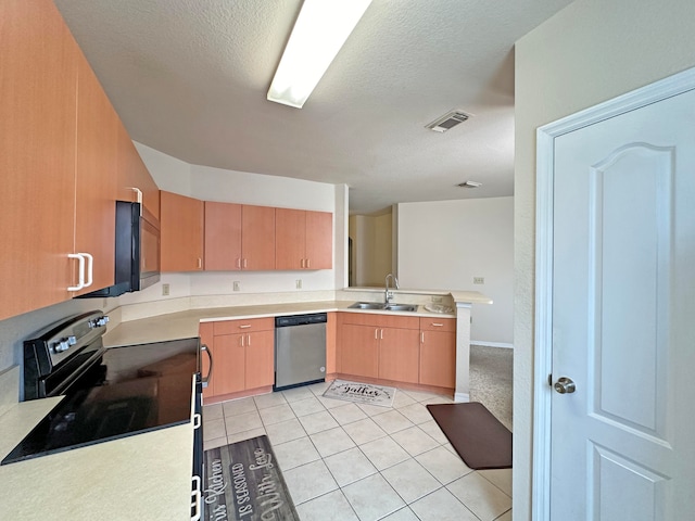 kitchen with sink, stainless steel dishwasher, electric stove, light tile patterned floors, and kitchen peninsula