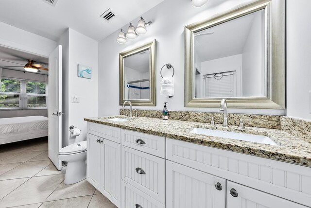 full bathroom with visible vents, a sink, toilet, and tile patterned floors