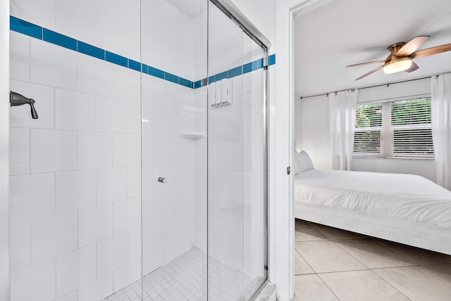 tiled bedroom featuring ceiling fan