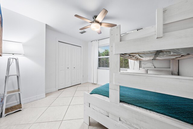 bedroom featuring ceiling fan and light tile patterned floors