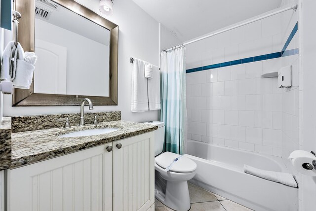 bathroom with toilet, visible vents, vanity, tile patterned floors, and shower / bath combo