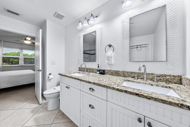 bathroom with visible vents, a sink, and tile patterned floors