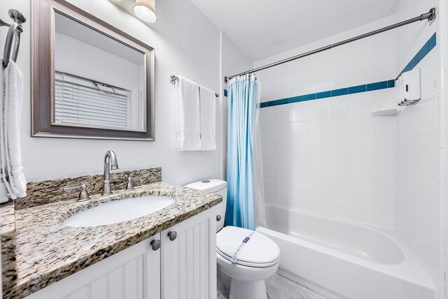 bathroom featuring shower / tub combo, vanity, and toilet