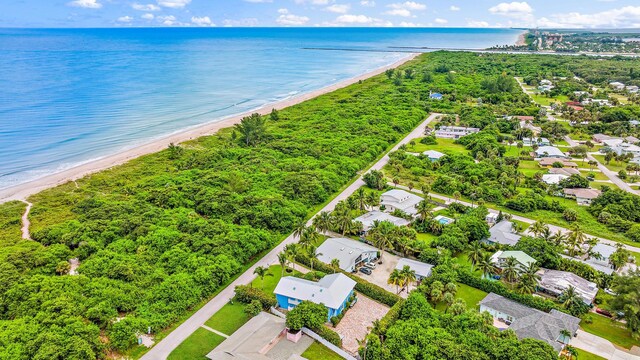 bird's eye view with a beach view, a residential view, and a water view