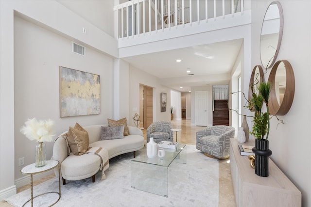 living room with a high ceiling