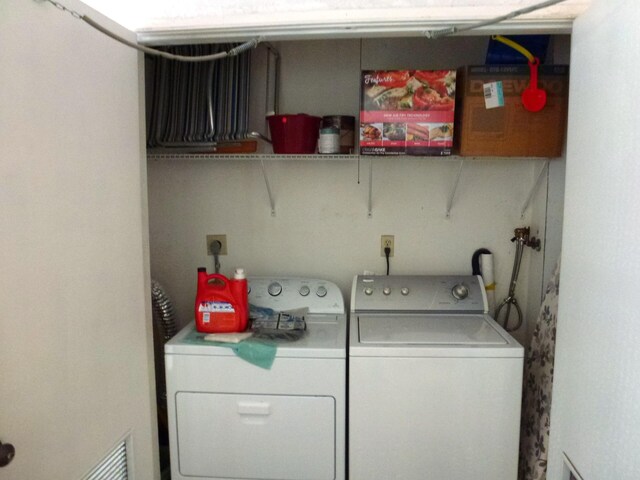 clothes washing area featuring washing machine and dryer