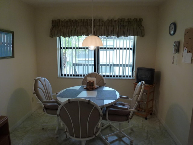 dining room with plenty of natural light and baseboards